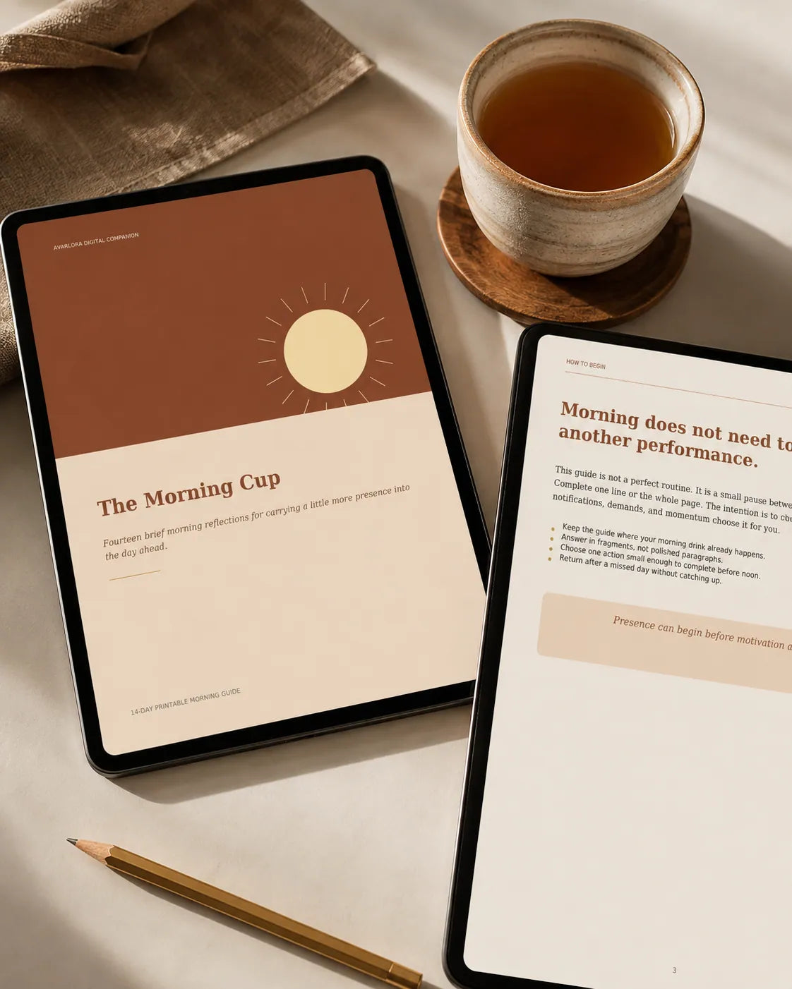 The Morning Cup digital companion displayed on tablets beside a cup of tea.