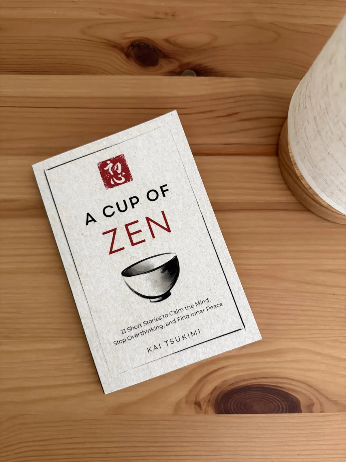 Reader photo of the book beside a cup of tea